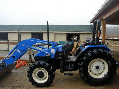 New 2005 holland TL90 4WD tractor w/front end bucket