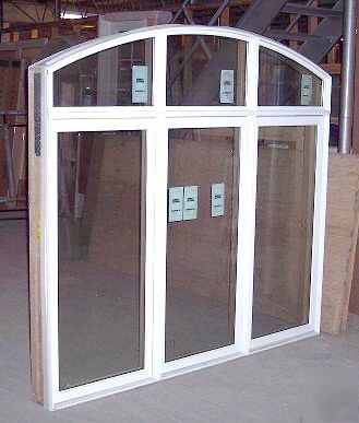 Marvin clad 3-wide casement window with roundtop