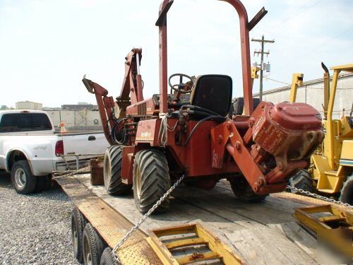 Ditch witch 3500 plow and hoe attachment, front blade