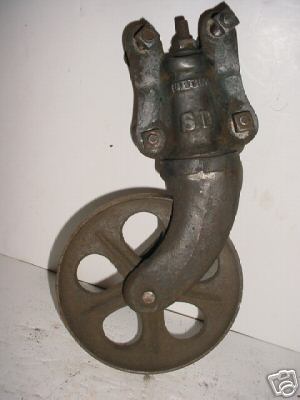Old cast iron nutting cart gas engine dolly wheel