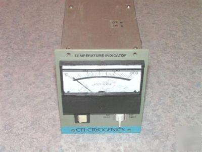 Analog temperature meter.
