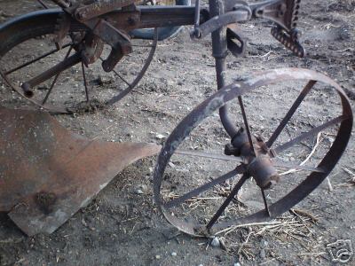 Horse drawn plow with steel wheels