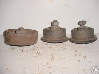 4 old cast iron chain or belt guide pulleys 