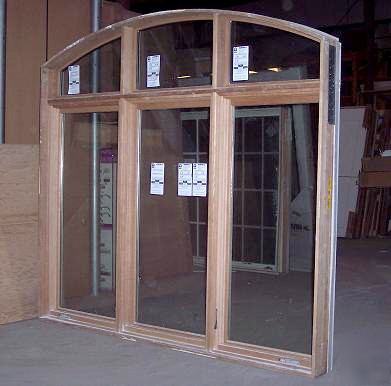 Marvin clad 3-wide casement window with roundtop