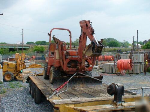Ditch witch 3500 plow and hoe attachment, front blade