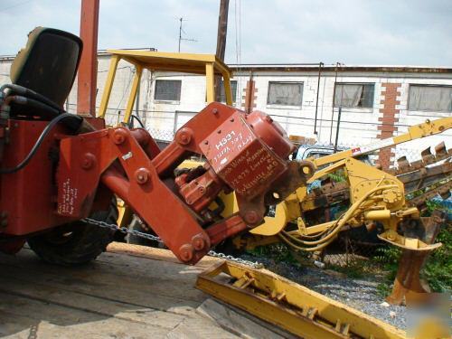 Ditch witch 3500 plow and hoe attachment, front blade