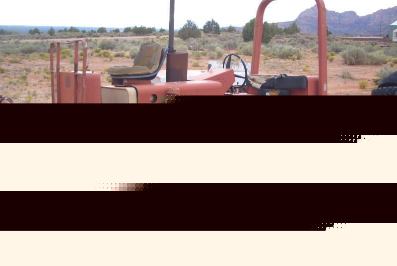 Ditchwitch 4X4 trencher, backhoe push blade combo