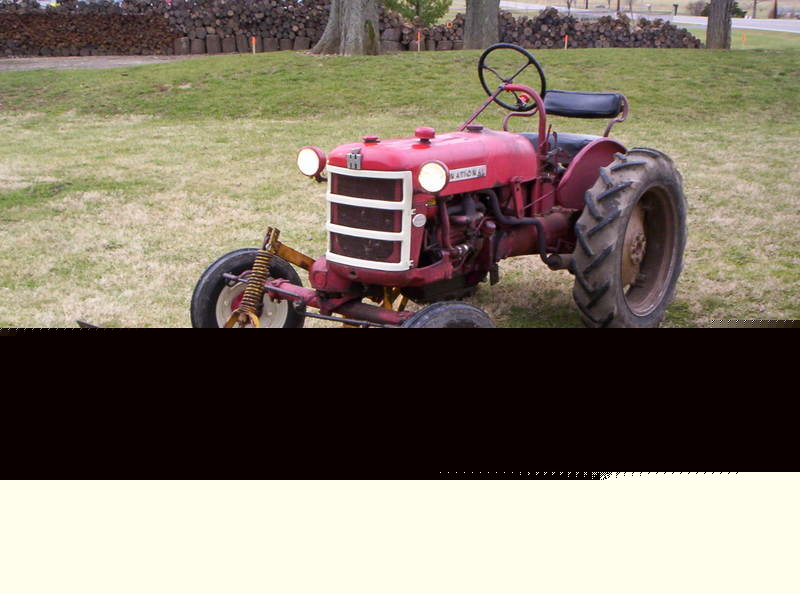Farmall cub lo-boy tractor with implements