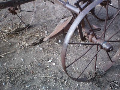 Horse drawn plow with steel wheels