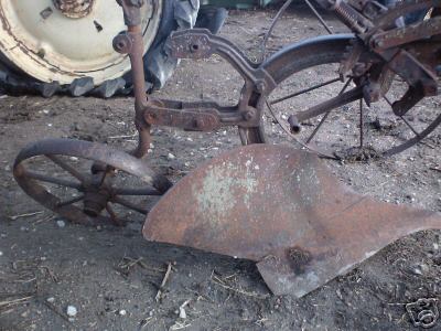 Horse drawn plow with steel wheels