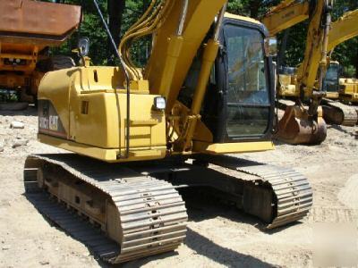 2002 cat 311CU excavator, good u/c, 26K lbs