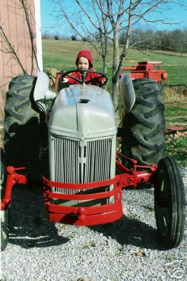 8N ford farm tractor red and grey late 40's model