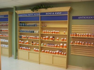 Custom made store shelving, gondolas, and cash wrap